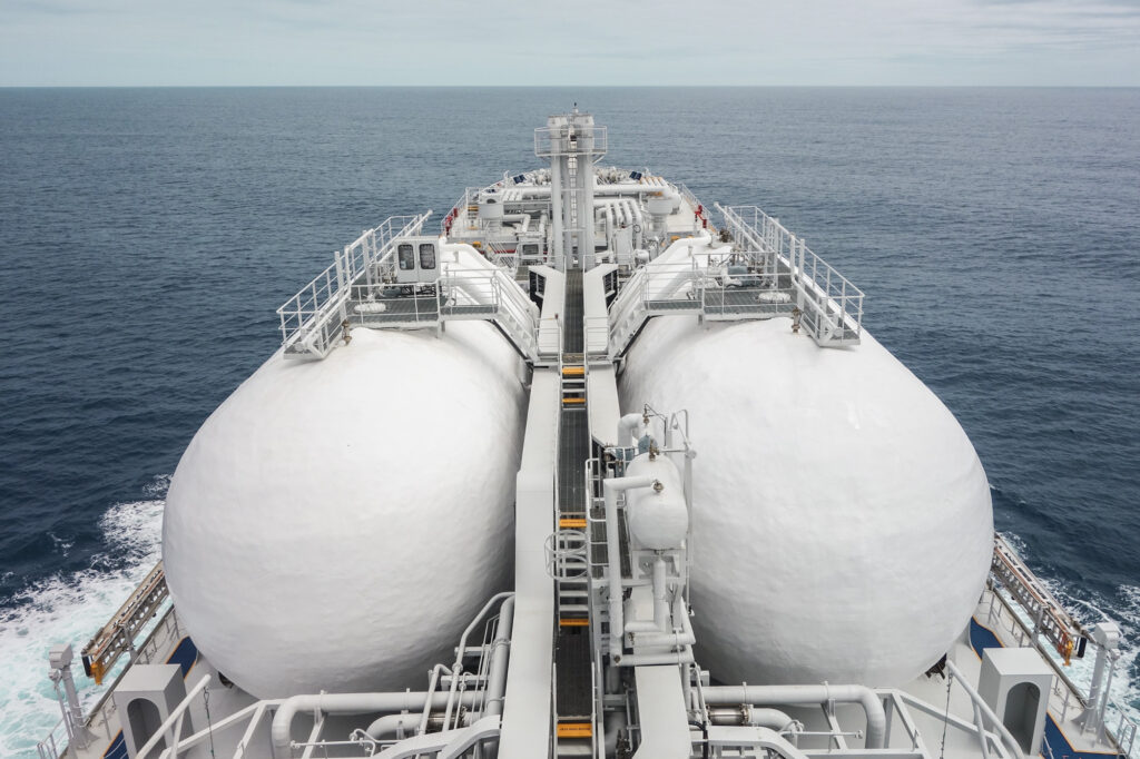 photo of gas storage tanks on ship deck, at sea